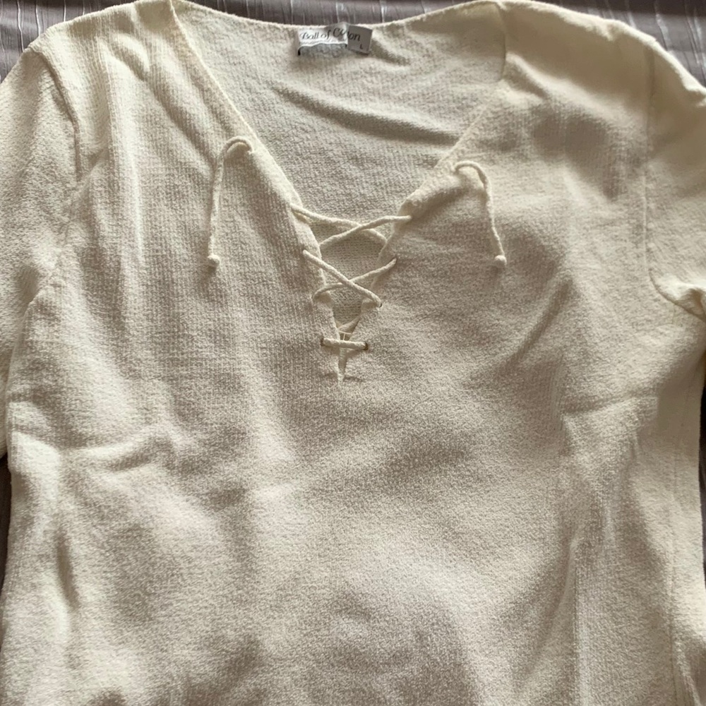 Ball of cotton lace up sweater